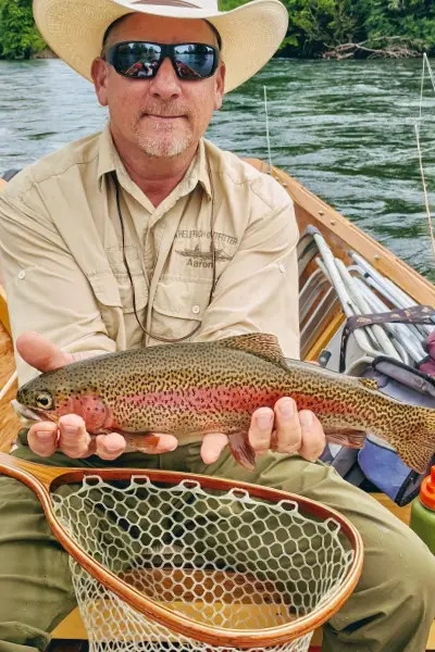 Fishing guide Aaron Helfrich with a McKenzie Redside trout